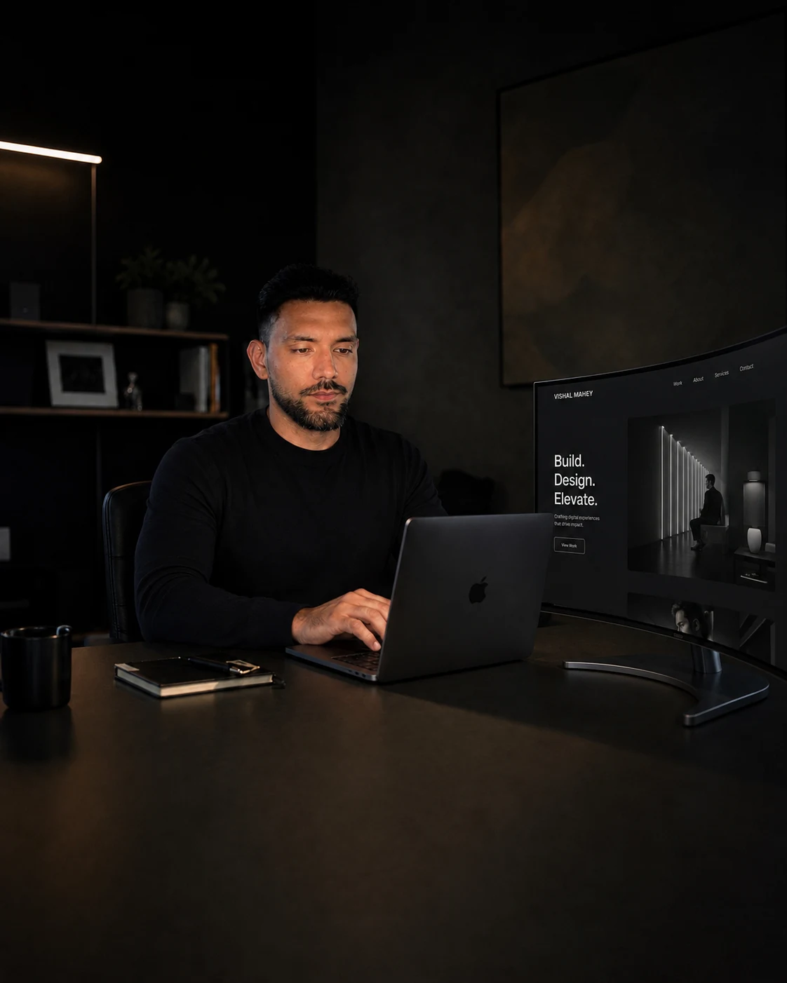 Vishal Mahey working at his desk